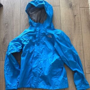 The North Face Vibrant Blue Rain Jacket size medium 10-12 child unisex - hood